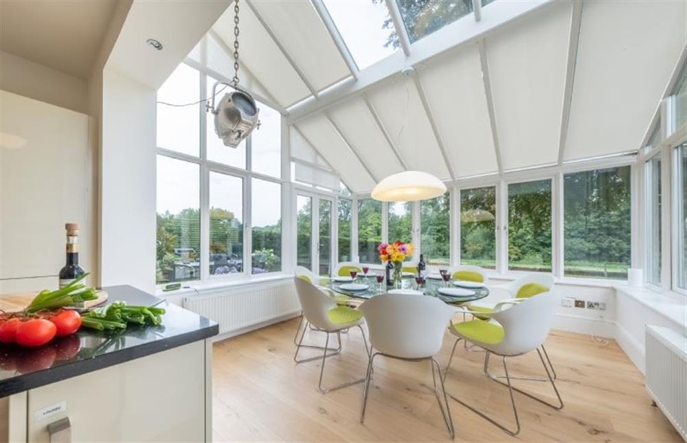 Ground floor: The delightful dining area in the conservatory at Beech House, Little Walsingham