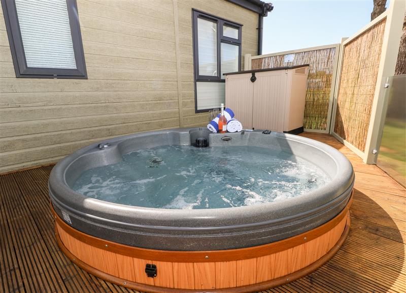 Enjoy the hot tub at Beechwood Lodge, Hasguard Cross near Broad Haven