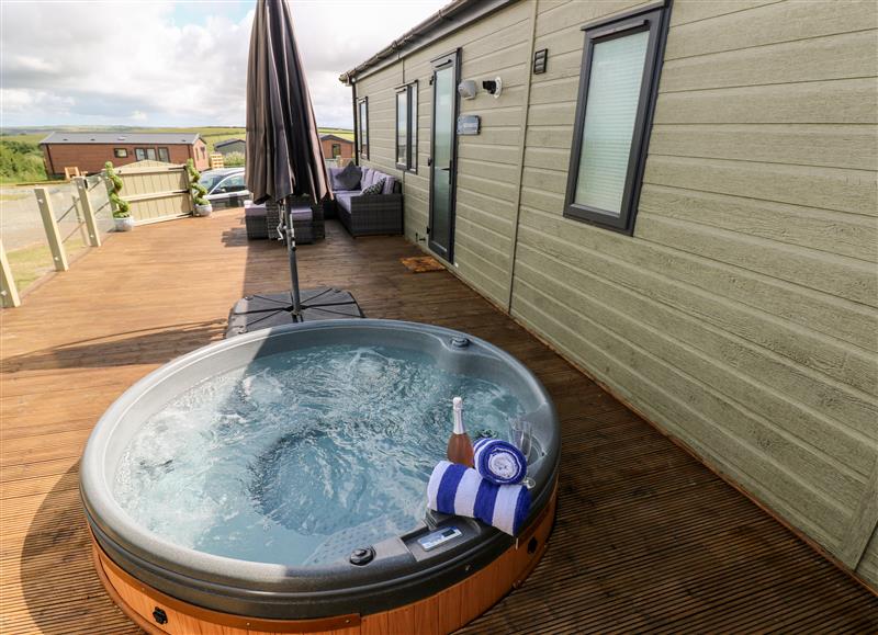 Relax in the hot tub at Beechwood Lodge, Hasguard Cross near Broad Haven