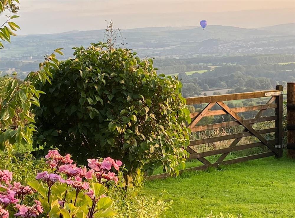 Hot air balloon flying over Beehive cottage at Beehive Cottage in Denbigh, Denbighshire