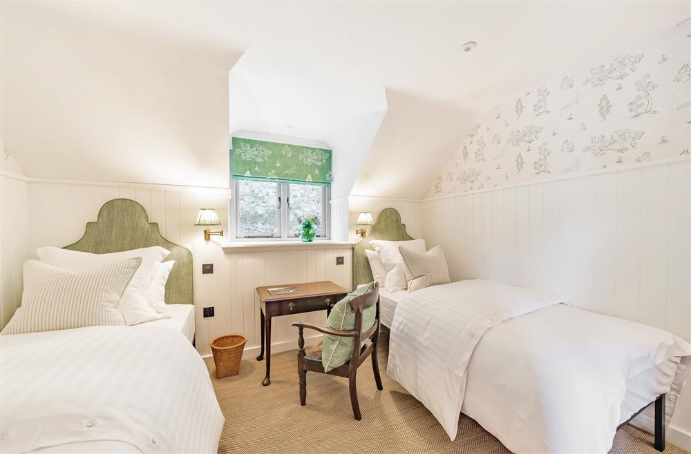 Comfortable twin beds in this charming bedroom at Beehive, Dorchester