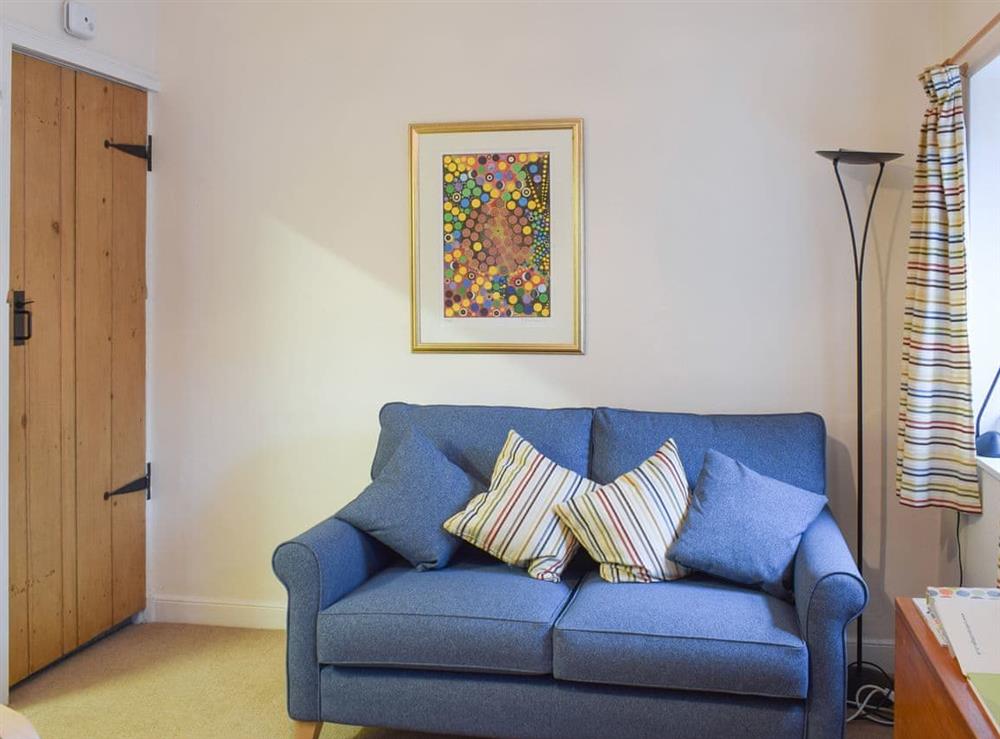 Comfortable seating within living area at Begbie Cottage in Bowness-on-Windermere, Cumbria