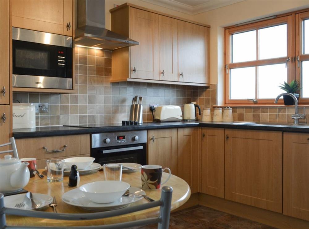 Kitchen with dining area at Beith in Hungladder, near Uig, Isle Of Skye