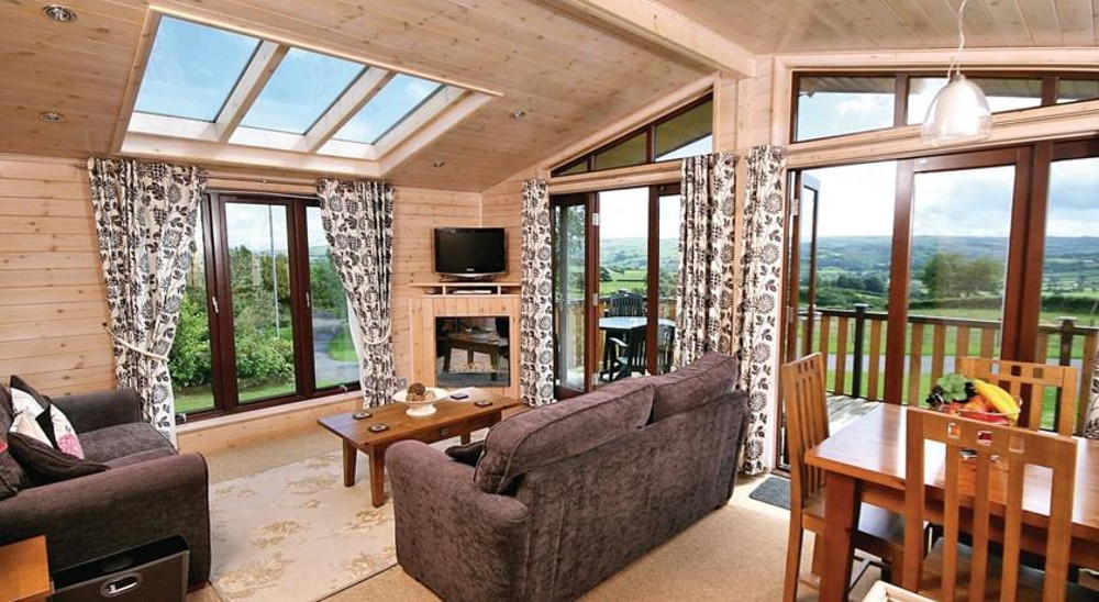 Inside a lodge, with views at Belan Bach Lodges in Powys, Wales