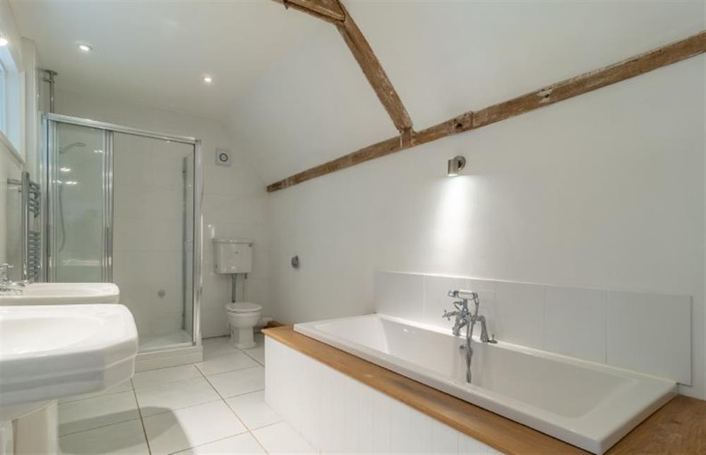 Bathroom with bath, separate shower, bath, twin wash basins and WC at Belchamp Hall Coach House, Belchamp Walter