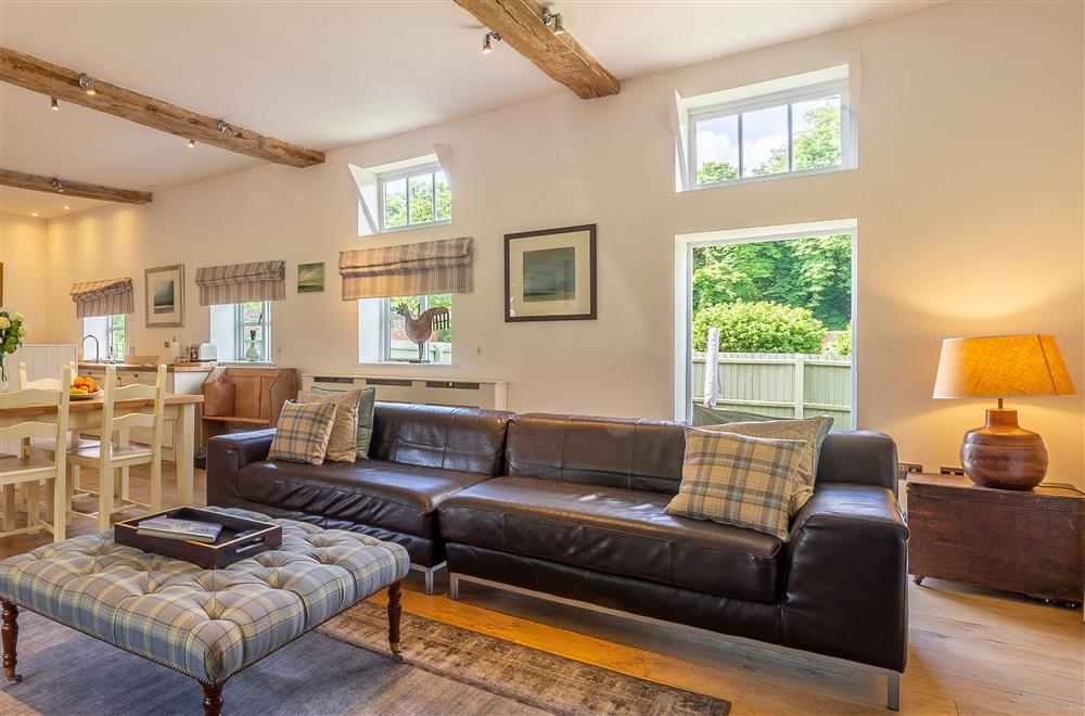 Open-plan living space with wood burning stove at Belchamp Hall Coach House, Belchamp Walter