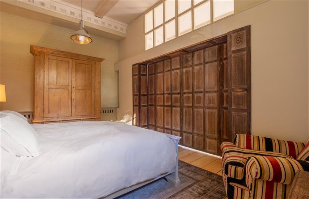 Spacious bedroom with a 6’ super-king size bed at Belchamp Hall Stables, Belchamp Walter
