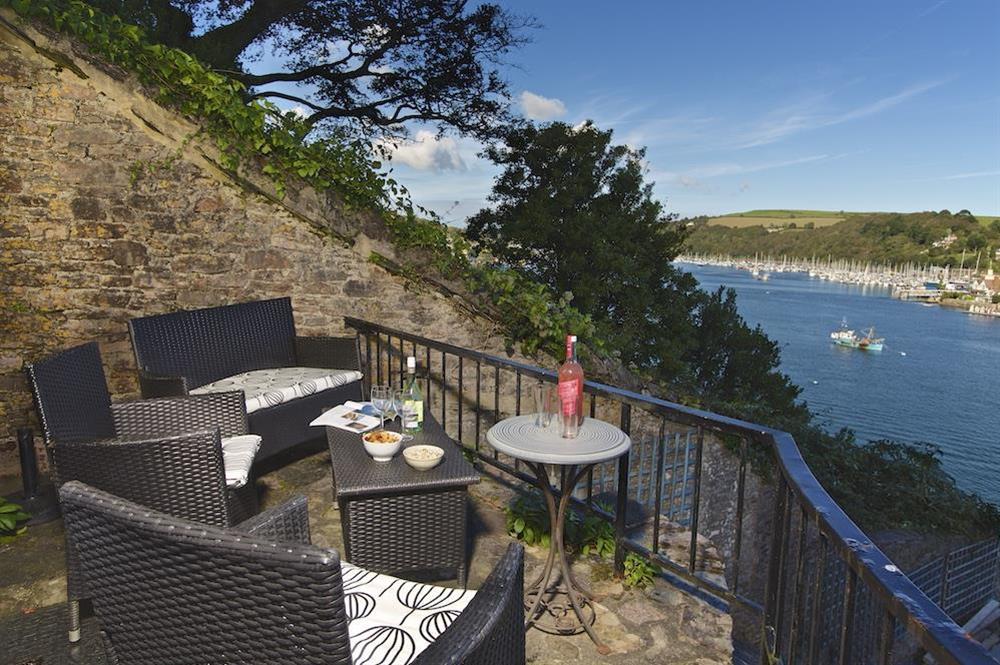Outdoor seating area with view of the river at Bell Cottage in South Town, Dartmouth