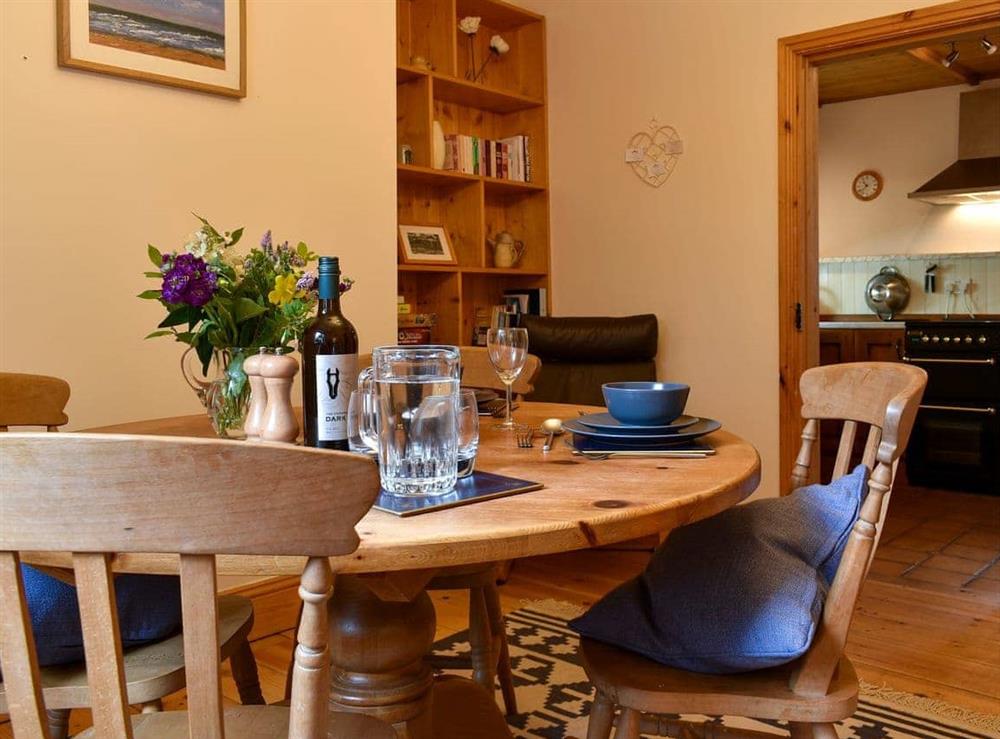 Dining room with wooden floor at Bell Hill Cottage in Lindale, near Grange-over-Sands, Cumbria