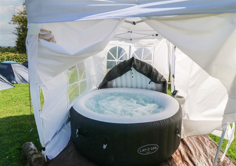 There is a hot tub at Bell Tent One, Holmesfield near Dronfield