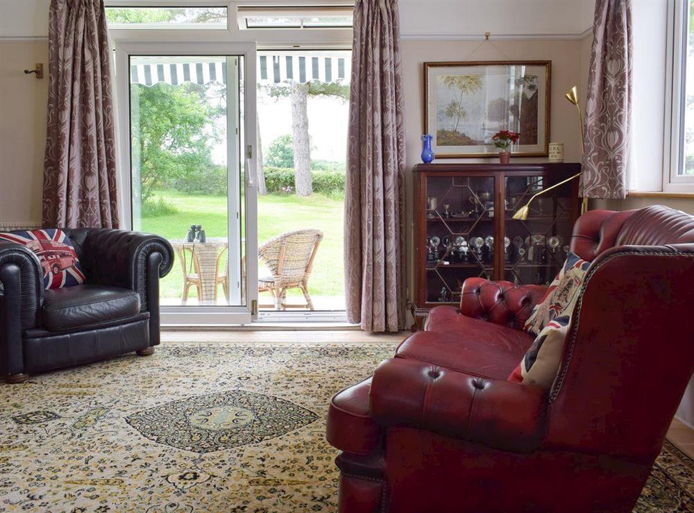 Spacious living room with French doors to garden at Bella Vista in Ryde, Isle of Wight
