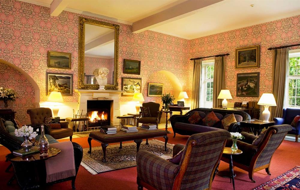Drawing room with open fireplace and piano (photo 2) at Belle Isle Castle, Enniskillen
