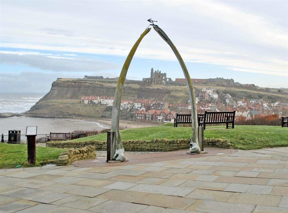 Whitby Abbey viewed through the famous whale jawbone at Belle Vue Cabin in Whitby, North Yorkshire