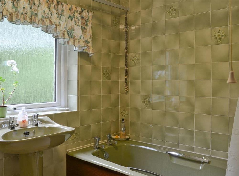 Bathroom with shower over bath at Bellegrove Cottage in Watermillock, Ullswater, Cumbria