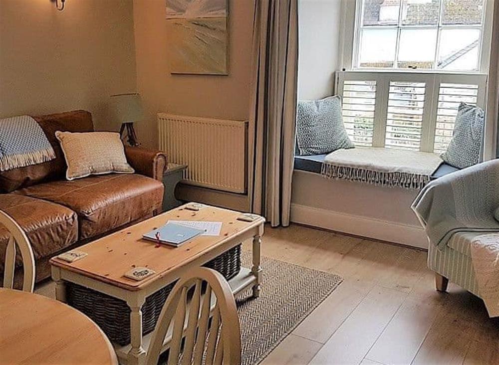 Comfortable living room with dining area at Below Deck in Fowey, Cornwall