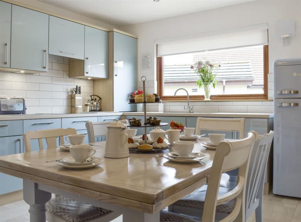 Well-equipped fitted kitchen with dining area at Ben The Hoose in Anstruther, Fife, Scotland