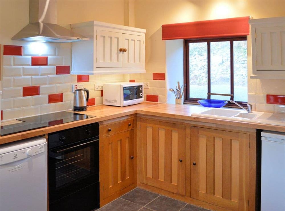 Well-equipped fitted kitchen at Benar Cottage in Penmachno, near Betws-y-Coed, Gwynedd