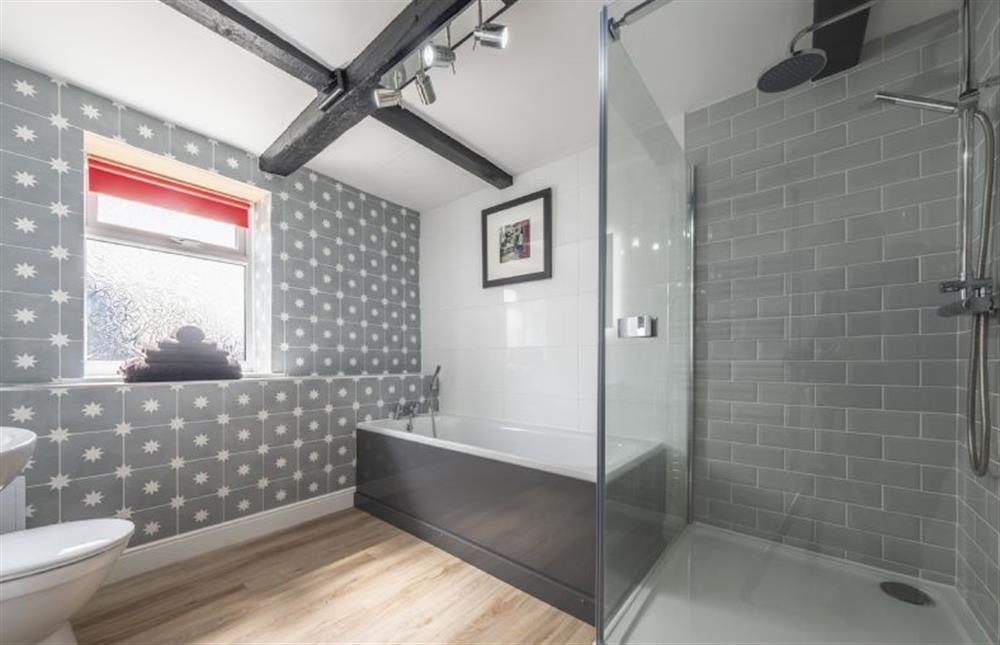 Bathroom with bath, separate shower, wash basin, WC and heated towel rail at Berlea House, Trimingham near Norwich