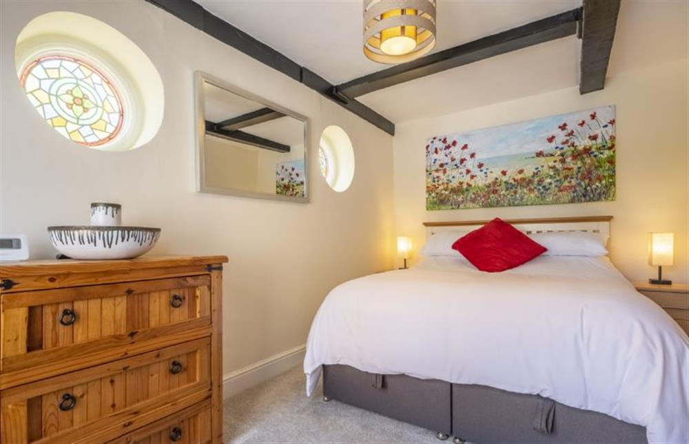 Bedroom with a king-size bed at Berlea House, Trimingham near Norwich