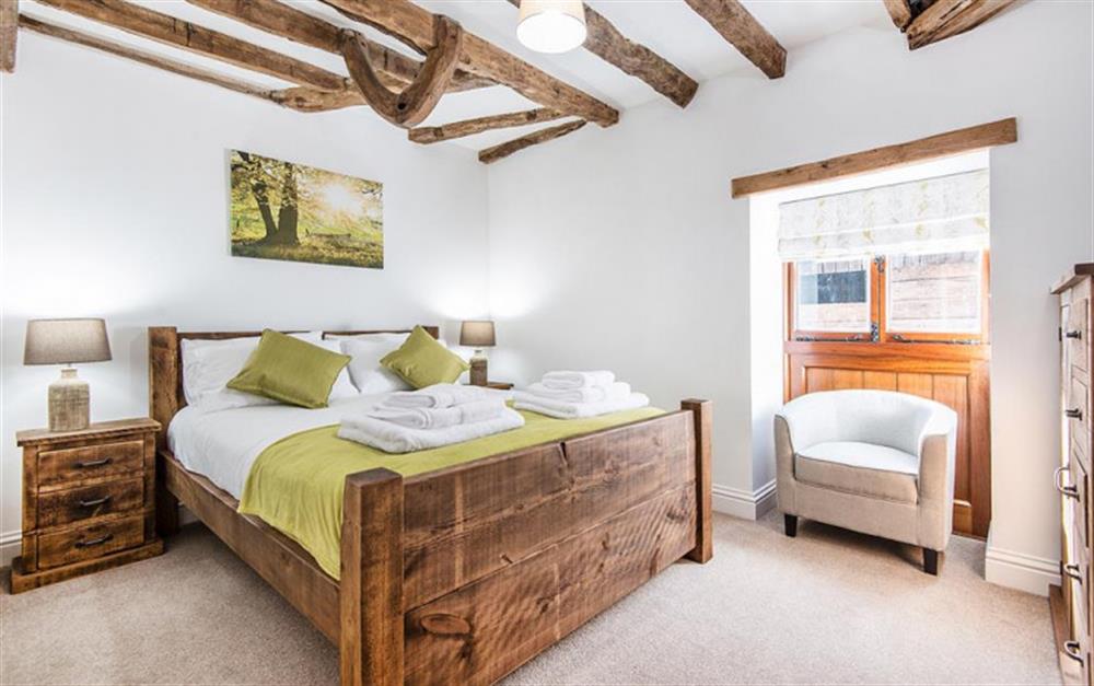 The ground floor bedroom with Kingsize bed at Berry's Barn in Colyton