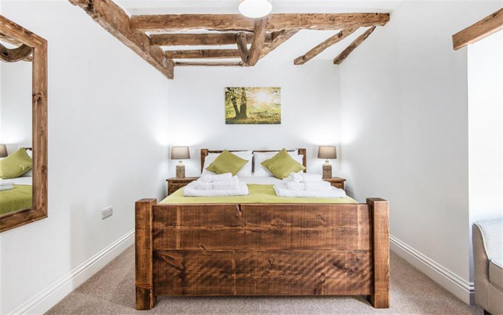 The sumptuous bedroom on the ground floor at Berry's Barn in Colyton