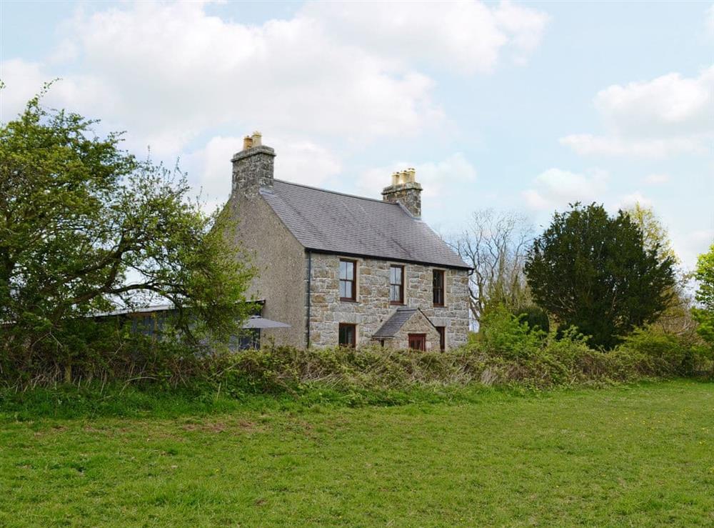 Traditional detached, stone farmhouse at Bettws y Gwynt in Llanbedrgoch, near Benllech, Anglesey, Gwynedd