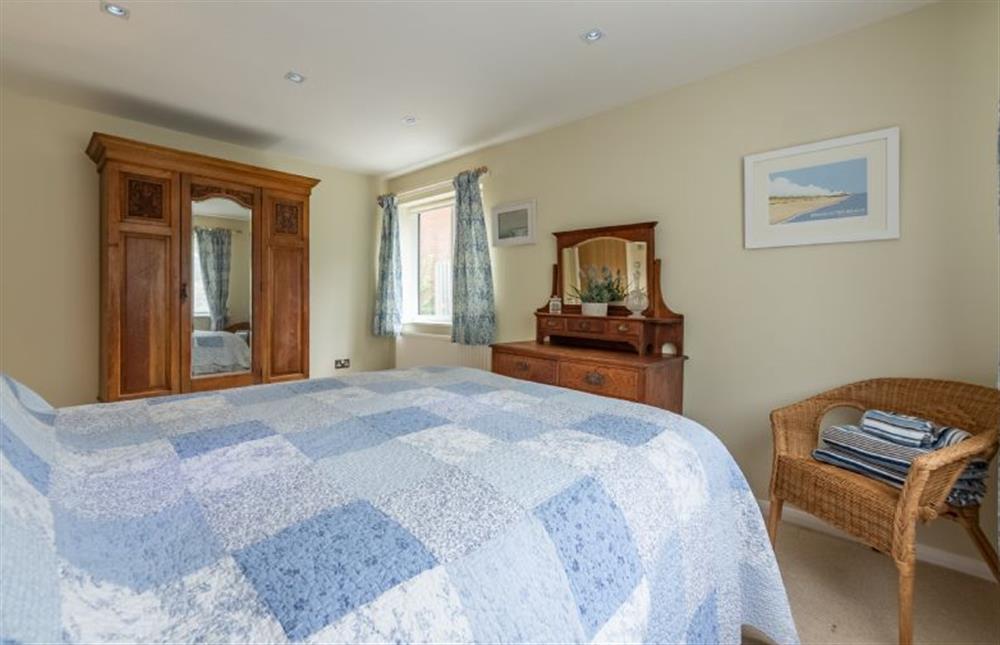 Ground floor: Bedroom two with king-size bed (photo 2) at Bettys Cottage, Brancaster near Kings Lynn
