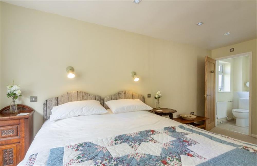Ground floor: Master bedroom with en-suite at Bettys Cottage, Brancaster near Kings Lynn