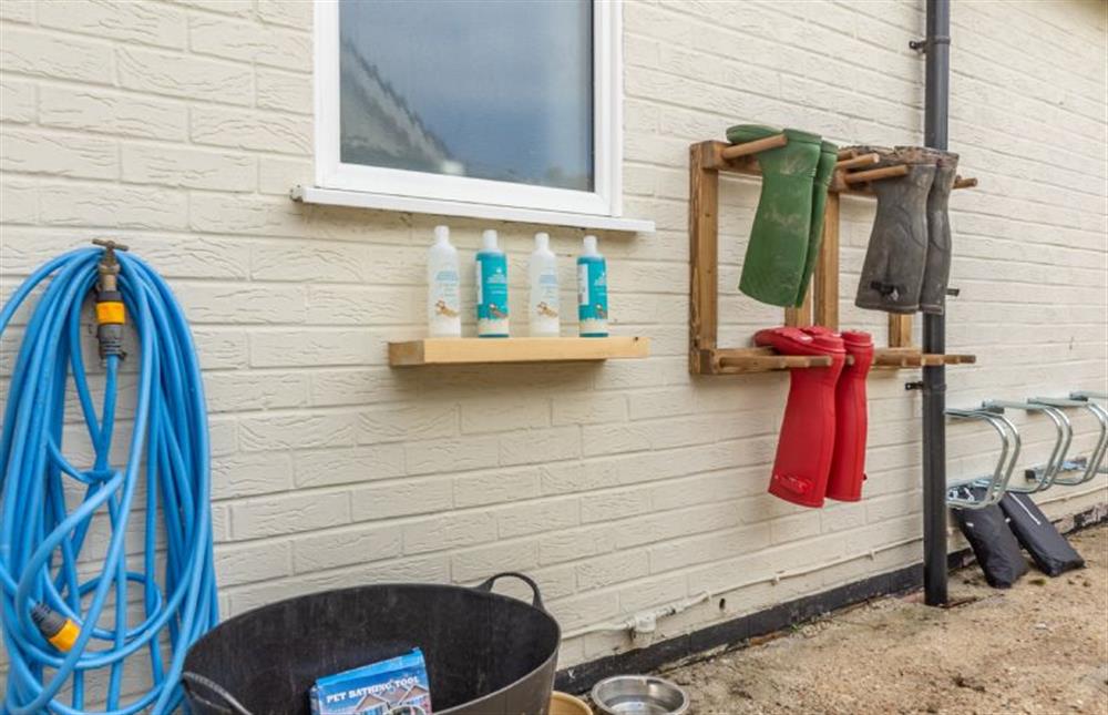 Pamper your pooch with this bespoke dog wash area with welly rack at Bettys Cottage, Brancaster near Kings Lynn