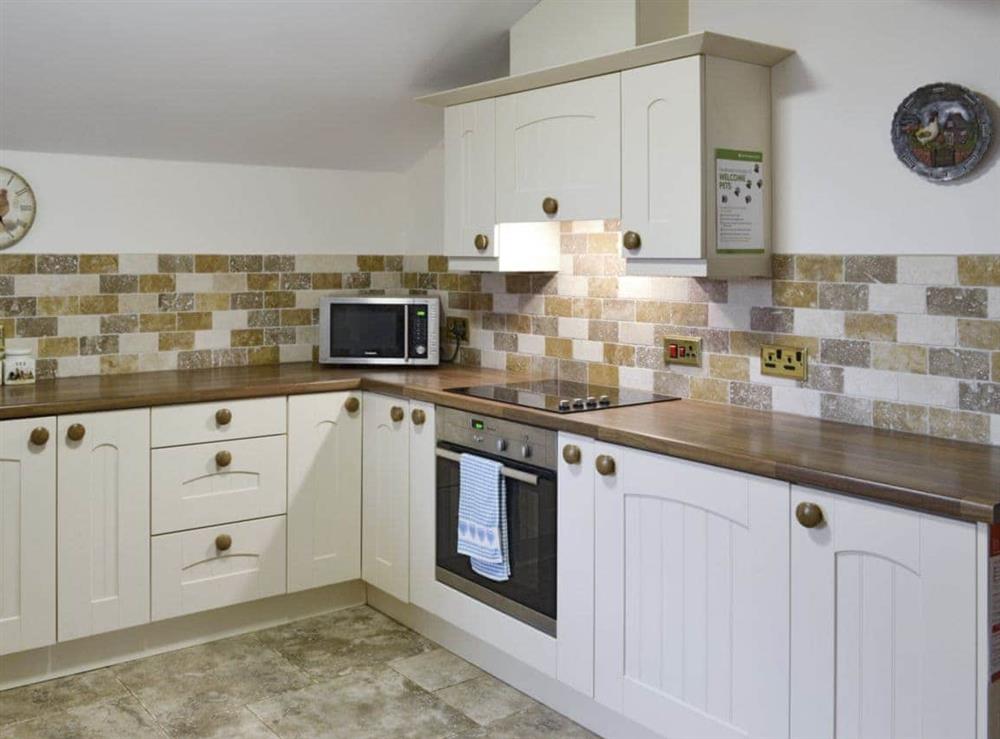 Well-equipped fitted kitchen at Beudy Hen in Llanfair, near Harlech, Gwynedd