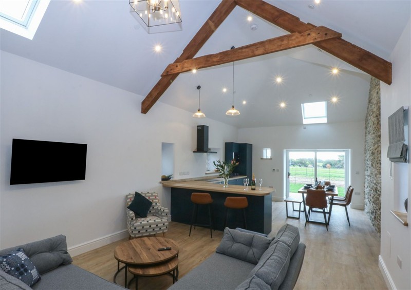 Relax in the living area at Beudy Tanrallt, Llanfachraeth