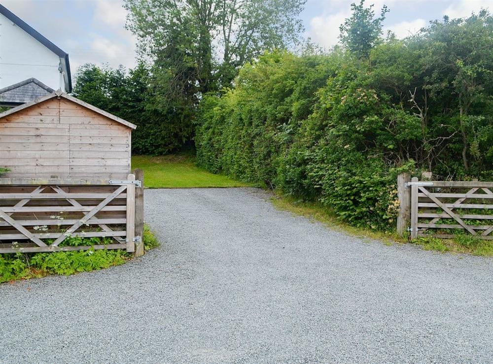 Gated driveway with ample parking at Bevan House in Hundred House, near Builth Wells, Powys
