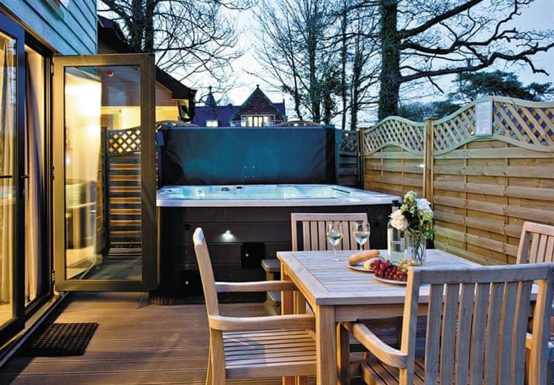 Hot tub and outdoor area in the Beyond Lodge at Beyond Escapes Devon in Paignton, South Devon