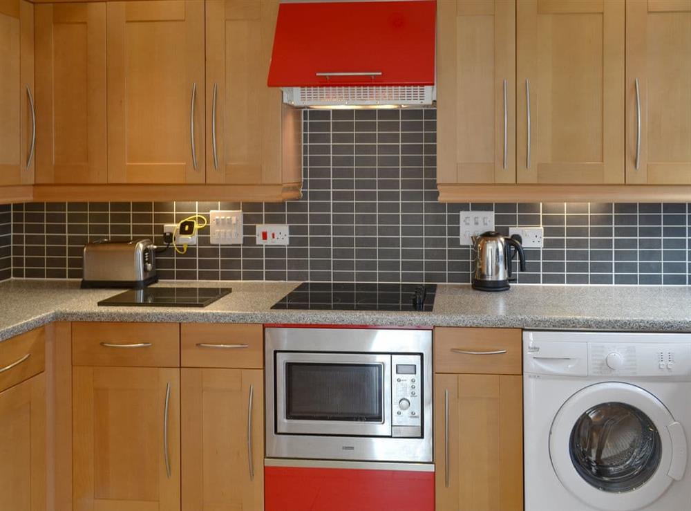 Built-in oven and hob in fitted kitchen at Bay Blue, 