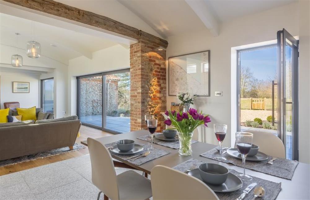 Ground floor:  Dining area with table and seating for four at Big Sky Barn, Ridlington near Norwich