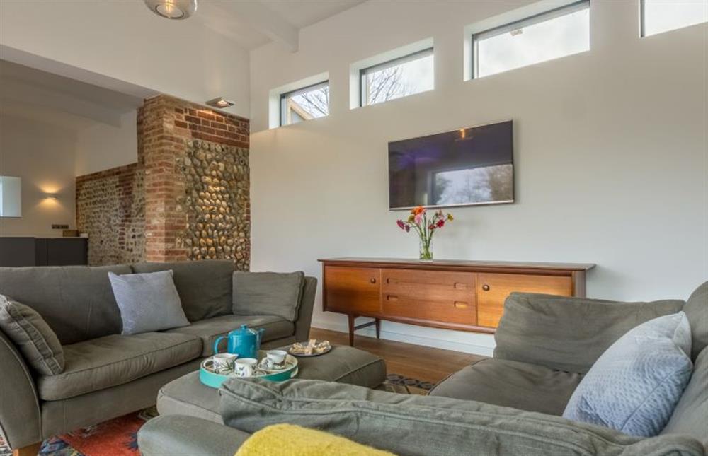 Ground floor:  Sitting room with comfy seating at Big Sky Barn, Ridlington near Norwich