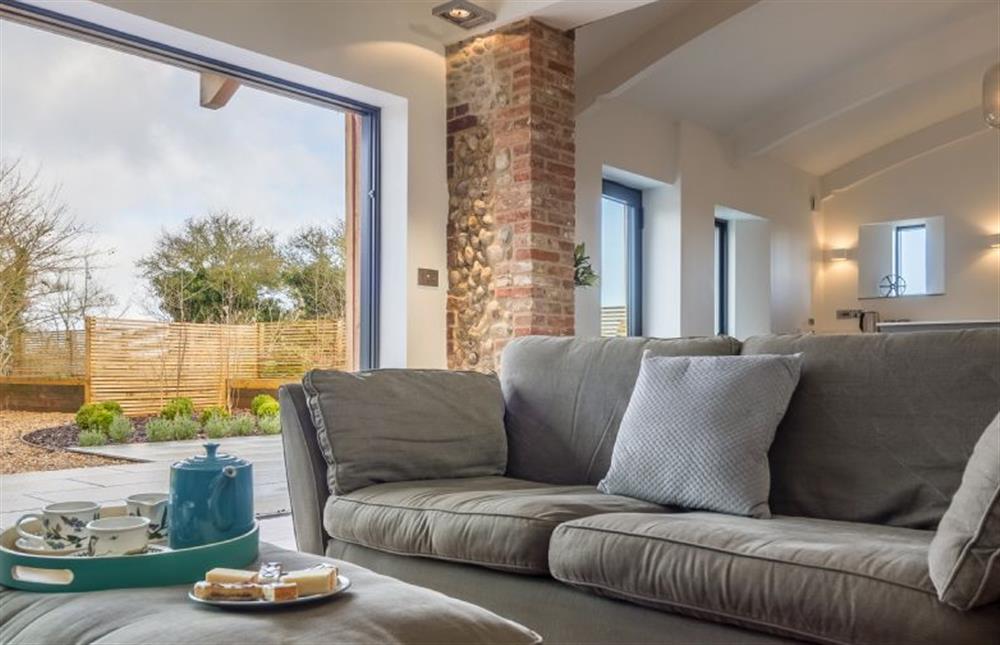 Ground floor:  Sitting room with view to courtyard at Big Sky Barn, Ridlington near Norwich