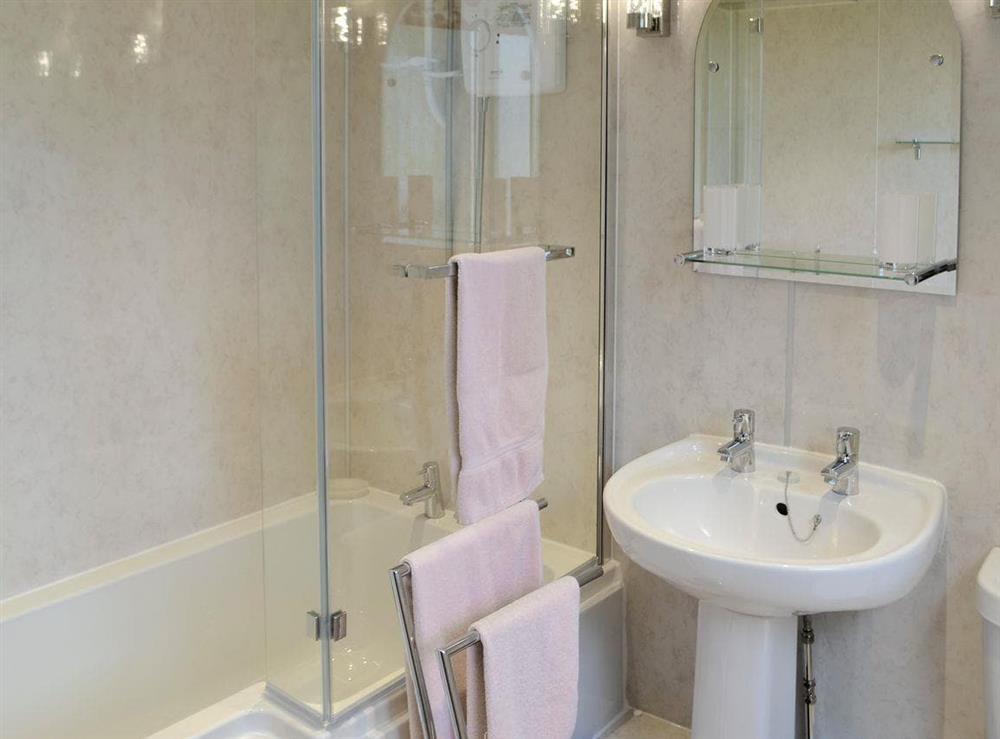 Family bathroom with shower over bath at Birch Cottage in Byrness Village, near Otterburn, Tyne And Wear