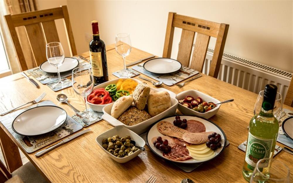There's ample space at the dining table for family meals or a game of Trivial Pursuit. at Birch Cottage in Falmouth