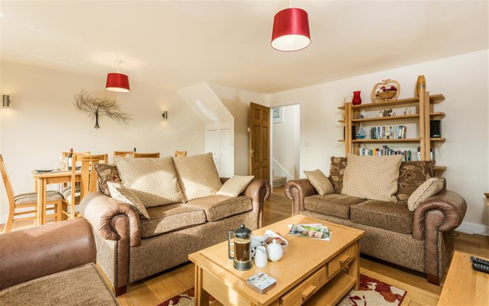 Whether you're dining or relaxing, the lounge is a light and airy room, and if you're lucky, the space  will be flooded with sunshine! at Birch Cottage in Falmouth