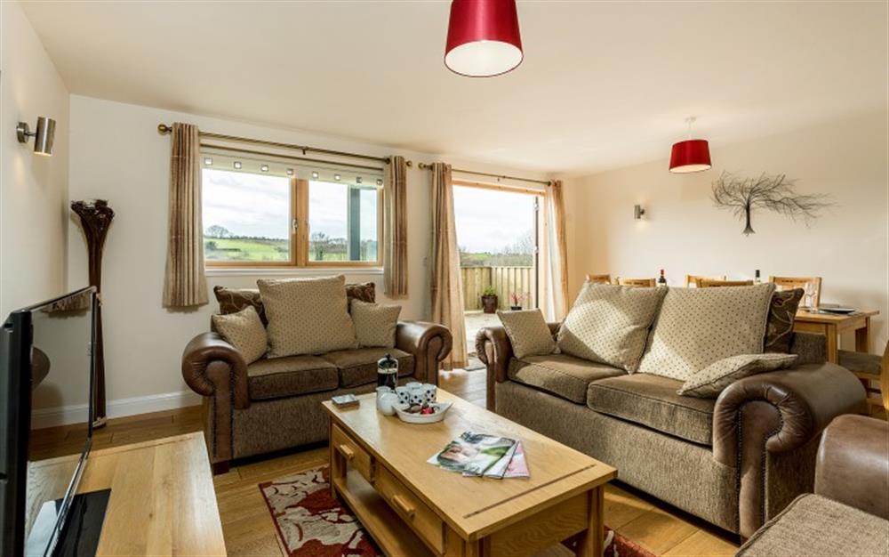 You'll have great views of the golf course and surrounding countryside from the decking, which is accessed from the lounge. at Birch Cottage in Falmouth