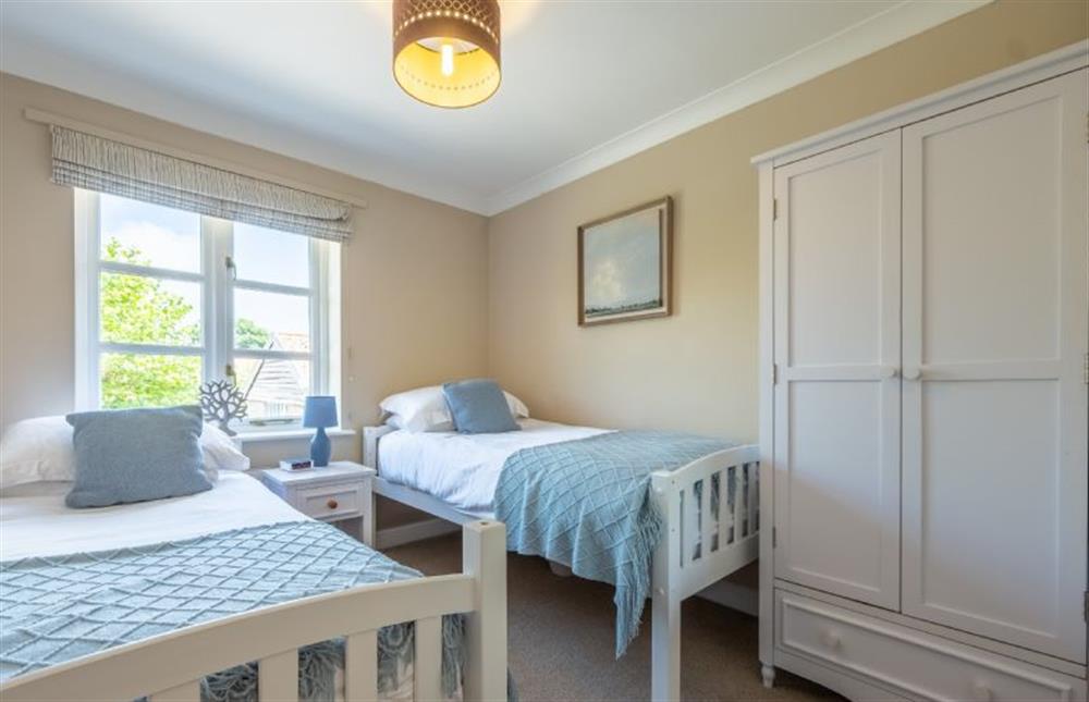 Bedroom three with twin beds and wardrobe at Birch Cottage, Northrepps near Cromer