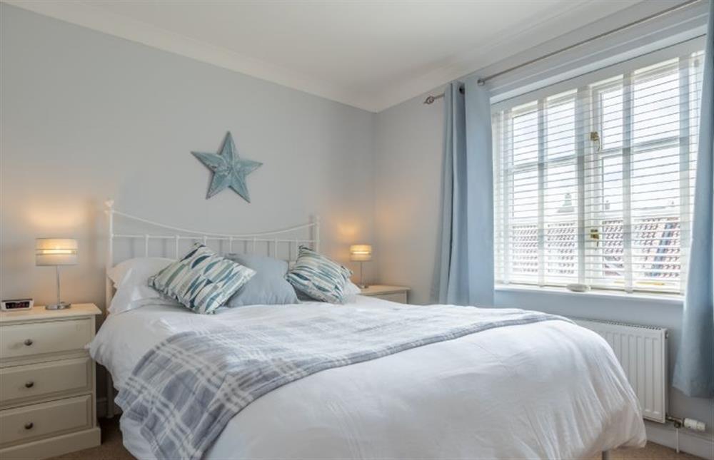 Master bedroom with 5’ king-size bed at Birch Cottage, Northrepps near Cromer