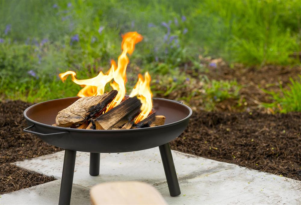 The fire pit provides comforting warmth on cooler nights