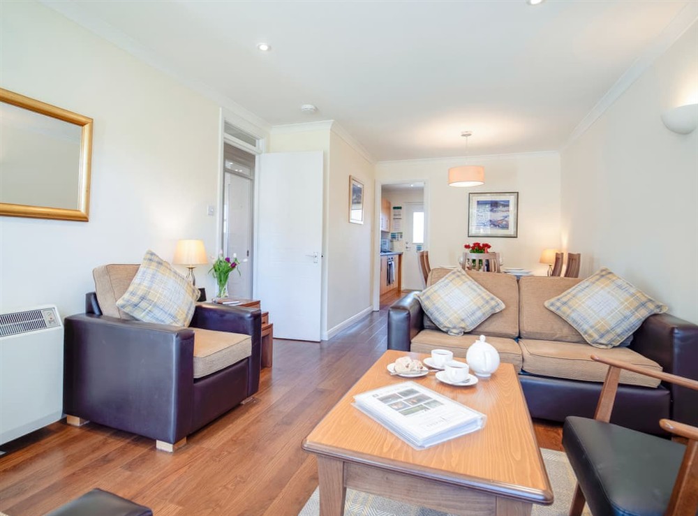 Living room/dining room at Birchdale Cottage in Aviemore, Inverness-Shire