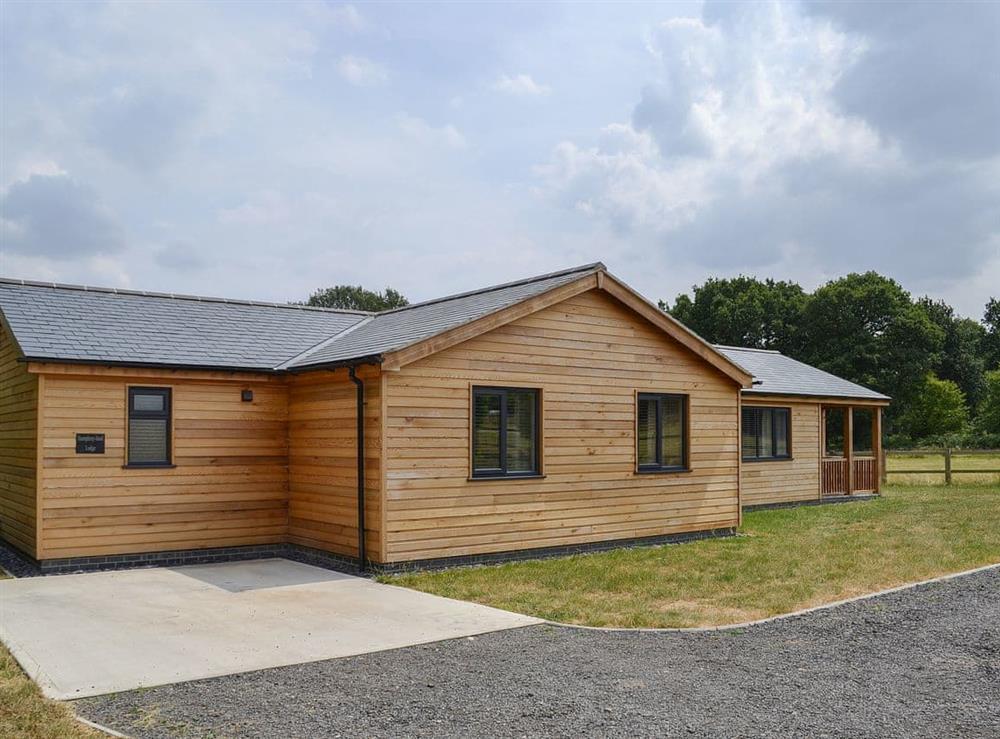 Cabin-style holiday cottage with dedicated parking area