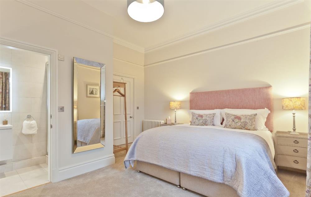 Bedroom with 6’ super king size bed and en-suite at Birkdale House, Windermere