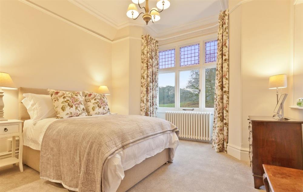 Bedroom with 6’ super king size bed at Birkdale House, Windermere
