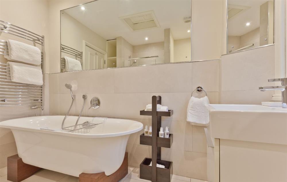 Family bathroom with roll top bath and double shower at Birkdale House, Windermere