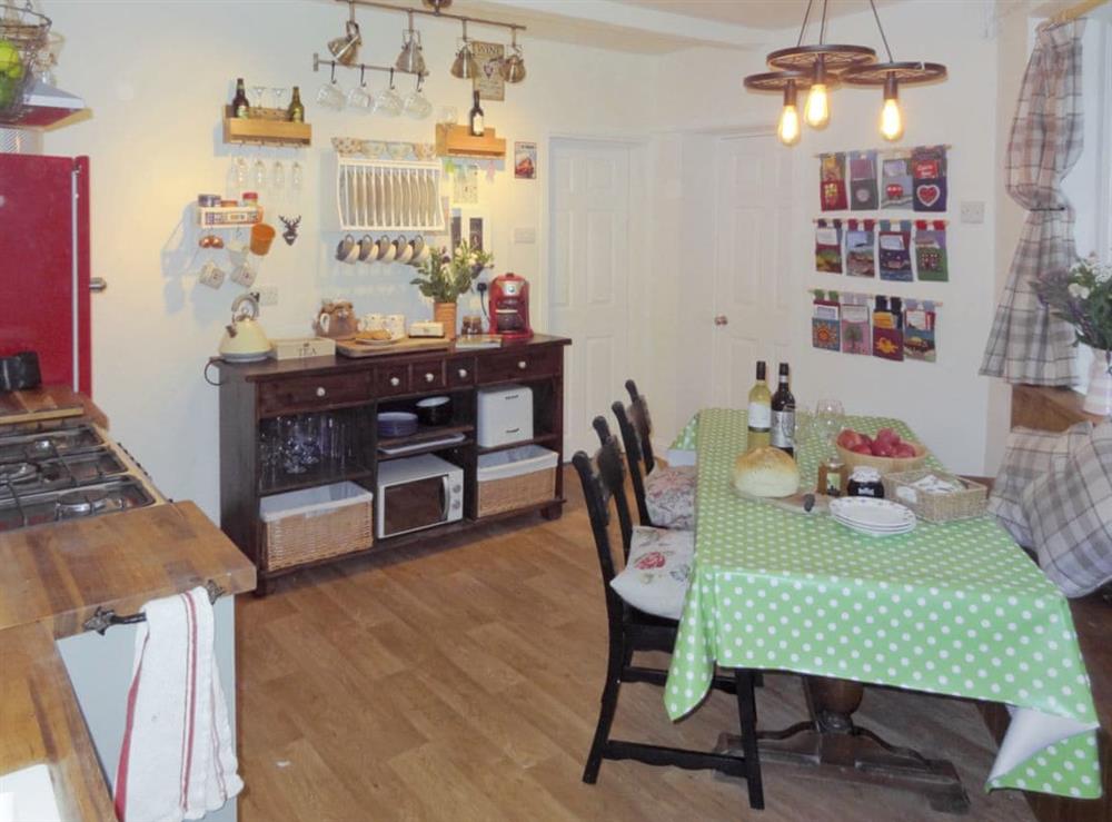 Charming kitchen with dining area at Birkenhead Cottage in Hebden Bridge, Yorkshire, West Yorkshire